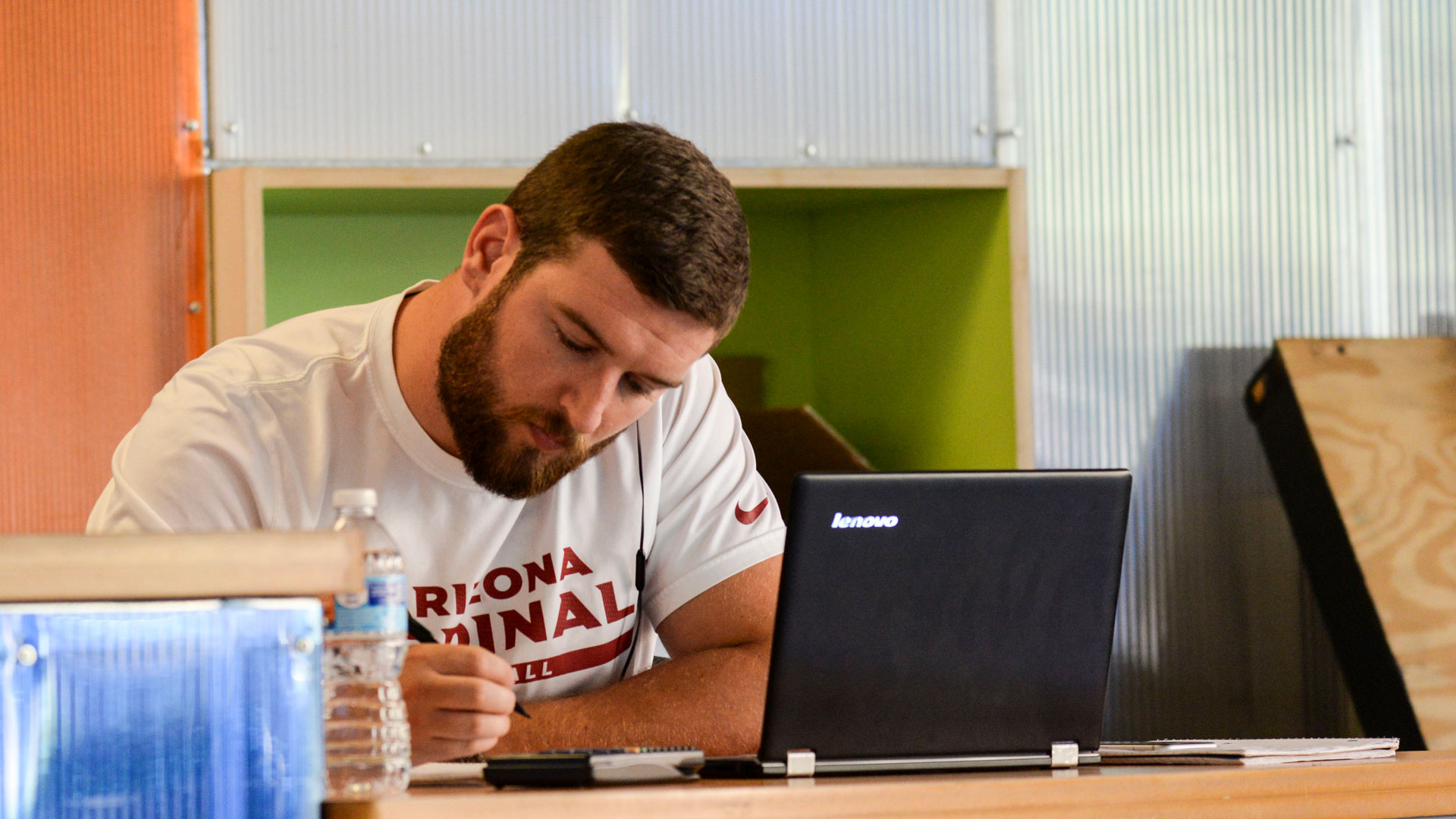 A student works on a laptop.