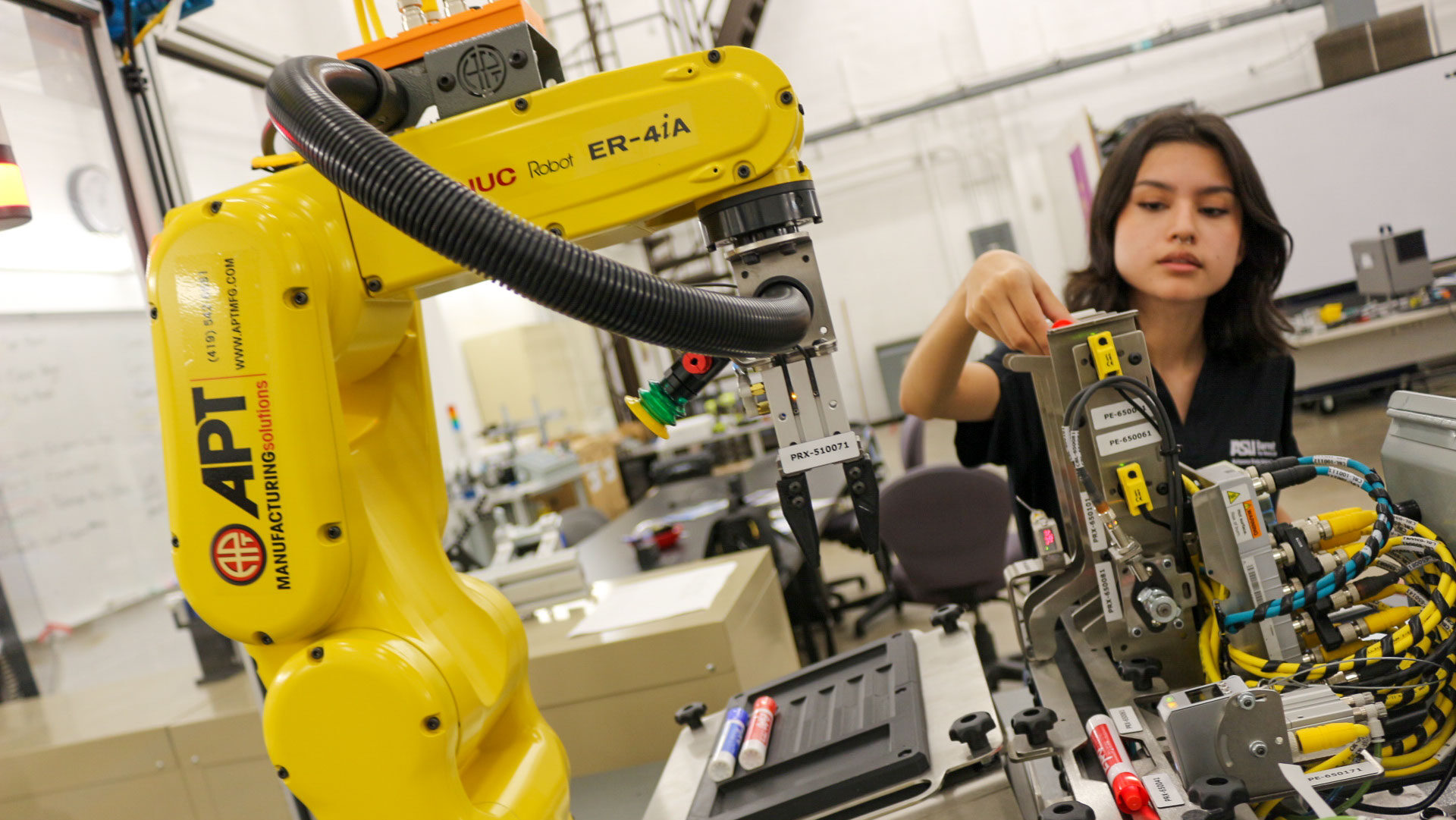 A student works with robotics equipment