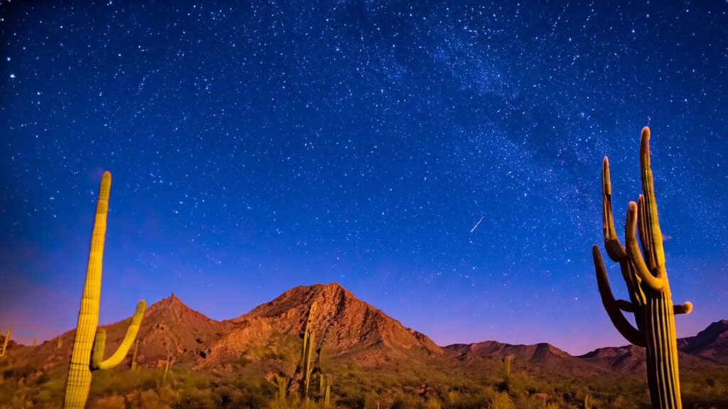 night sky over a desert landscape