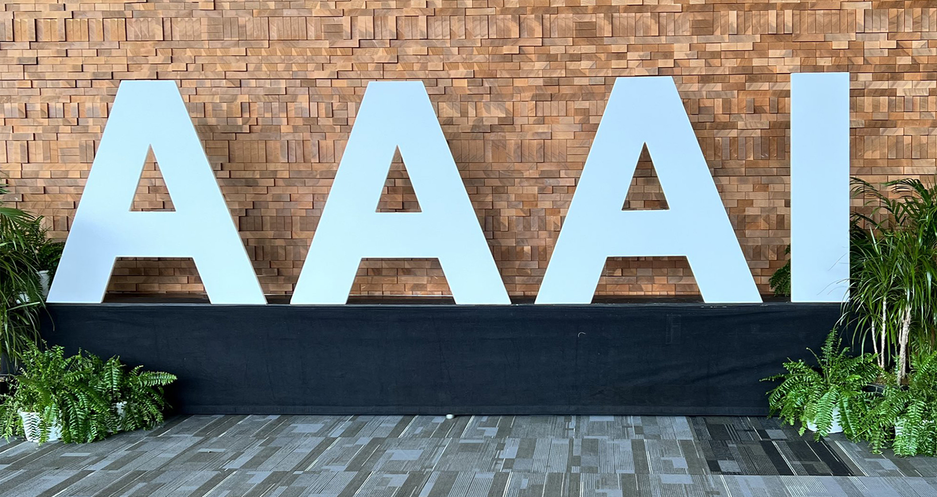 Large, silver letters spelling AAAI, taken from lobby of conference
