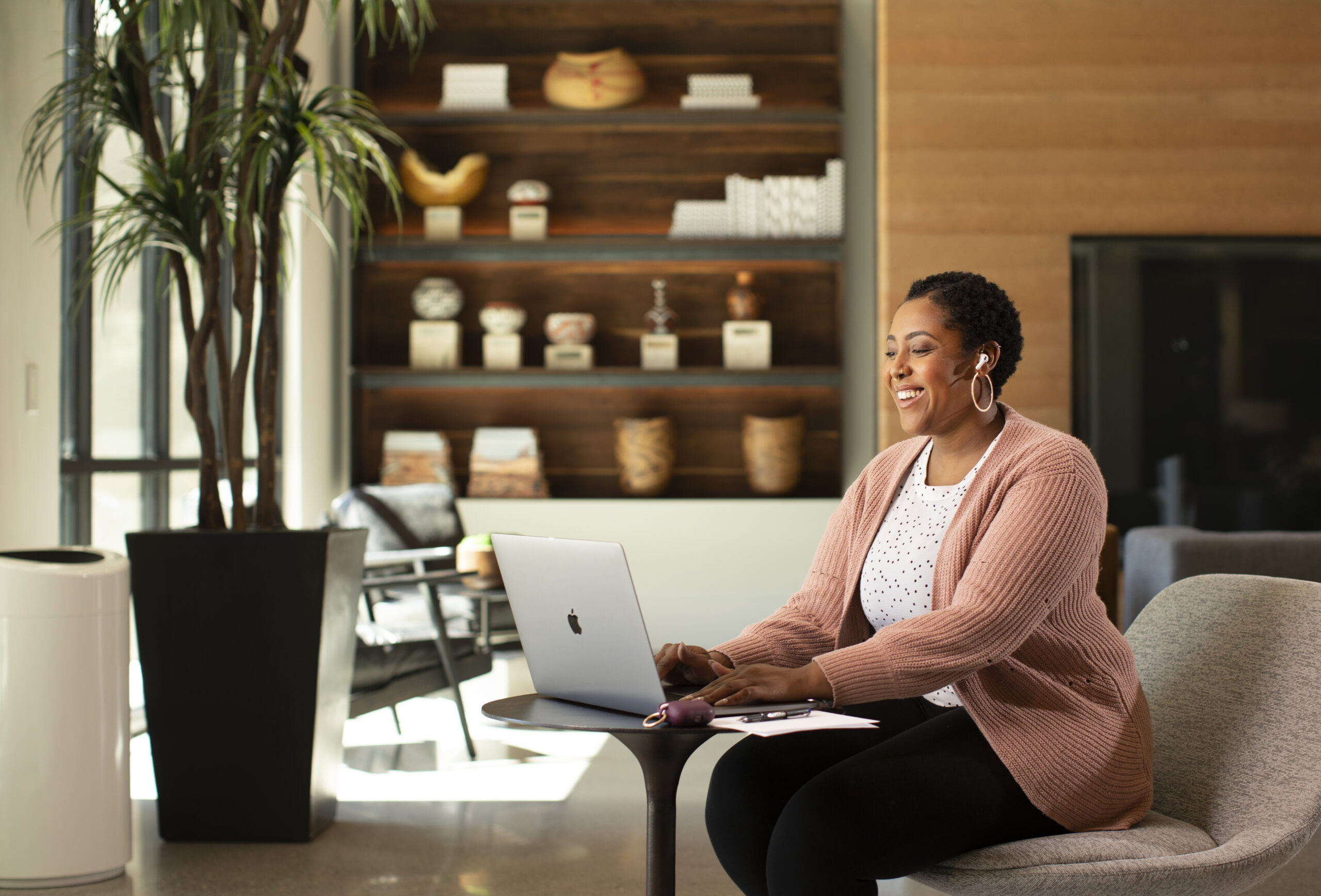 Woman on a laptop in a room.