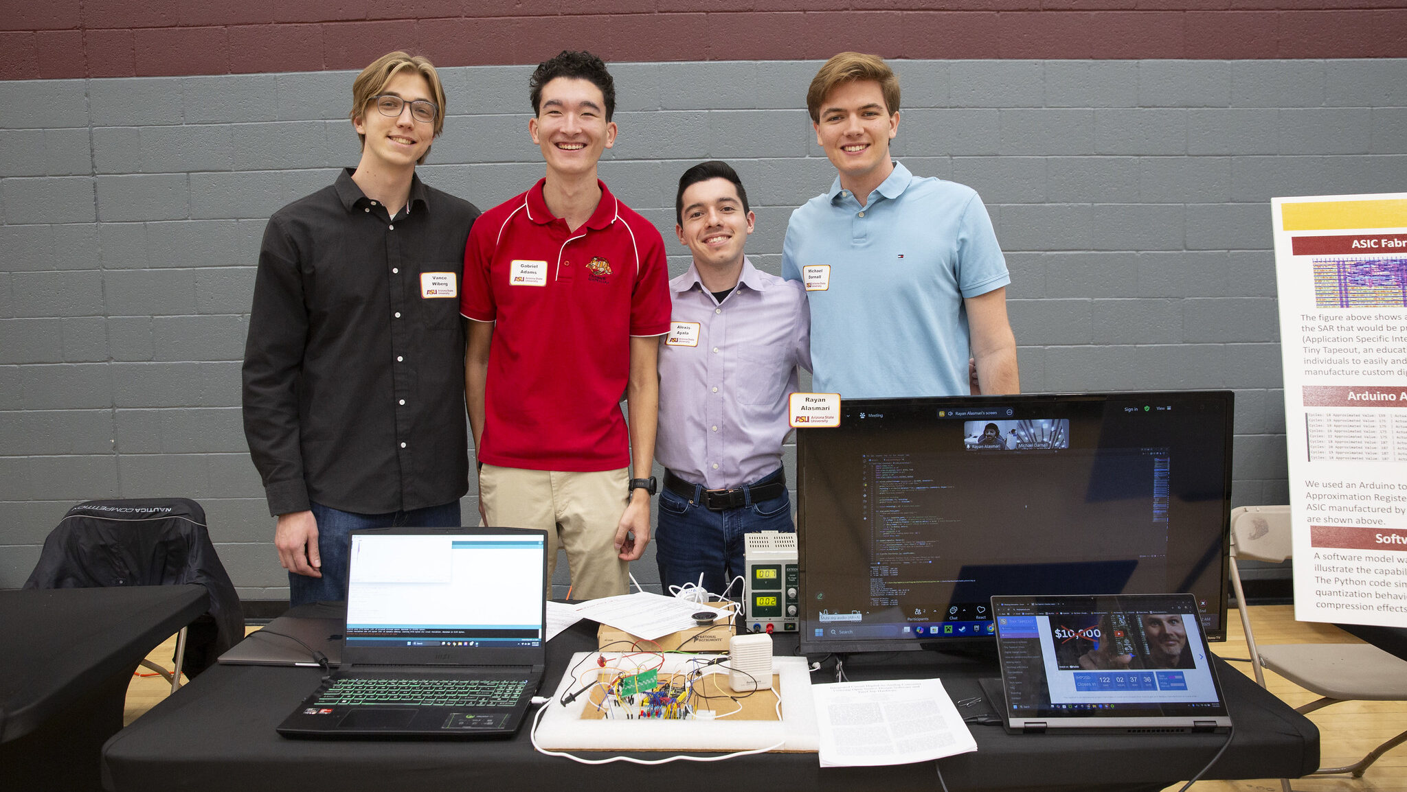 Students presenting research project and poster